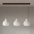Three White Pendant Lights Hanging From Brown Wooden Bar In Modern Interior