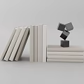 Minimalist White Books Display With Leaning Standing And Stacked Books And Black Cubes