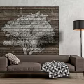 Two Seater Sofa With Checkered Blanket Striped Cushion Wooden Wall Tree Pattern And Floor Lamp