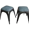 Two Modern Stools With Gray Fabric Seats And Black Metal Legs