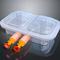 Decorative Ornament Set With Transparent Two Compartment Plastic Case And Orange Cylinders With Red Bases