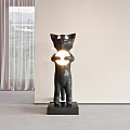 Black Cat Sculpture Holding Glowing Round Object on Base with Window Curtains Background