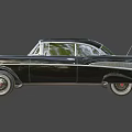 Black Vintage Classic Car With Chrome Grille Headlights And White Wall Tires