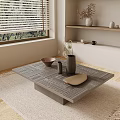 Modern Textured Coffee Table with Dried Flower Vase Bowl Plate and Shelves by Window