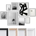 Stylish Photo Frames Displaying Black White Artworks And Palm Tree For Wall Decor