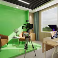 School Media Room With Green Walls Camera Tripod Sofas Laptop And Green Plants Outside Window