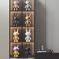 Rabbit Shaped Decorative Ornament Set With Gold Black White Purple Figurines On Display Shelf