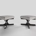 Two Modern Stools With Gray Upholstered Seats And Black Wooden Legs