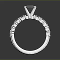 Elegant Diamond Ring With Large Central Stone And Small Accent Diamonds On Silver Band