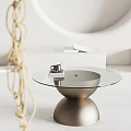 Minimalist Glass Top Coffee Table With Gold Base Black Cup White Books And Woven Decoration