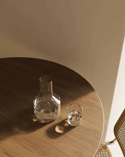 Clear Glass Cup And Carafe On Wooden Round Table With Light Colored Wall And Sunlight 3d model