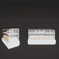 White Display Shelves for Bakery Desserts with Multiple Tiers and Assorted Pastries on Counter