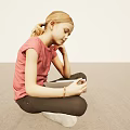 Child Girl Sitting Cross Legged on Floor Reading Book with Pink Shirt and Light Background