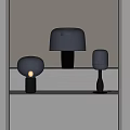 Modern Table Lamps on Light Colored Shelf with Transparent and Curved Shades