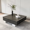 Modern Grid Design Coffee Table With Silver Legs Vase Green Plant Books And White Cup