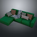 Modern Green L shaped Sofa With Plaid Blanket And Decorative Cushions
