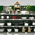 Cookware Display Shelf With Pots Pans Kettles Chalkboard And Green Plant