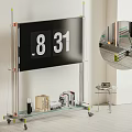 Modern TV Stand with Mounted TV Books Decor Items and Rolling Wheels