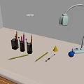 Desk Setup Featuring Desk Lamp Pen Holders Pencils Cone And Blue Sphere