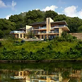 Modern Detached Villa With Lakeside View And Green Trees Scenic Night Lighting