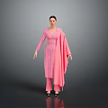 Woman In Pink Patterned Outfit With Long Sleeves And Pink Shawl Black Shoes Gray Background