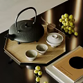 Elegant Tea Set with Black Teapot White Teacups on Wooden Tray and Green Grapes