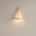 Modern Triangular Fabric Wall Lamp with Soft Lighting Mounted on Light Colored Wall