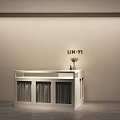 Minimalist Modern Clothing Store Interior With White Counter Vase Flowers And LIN-YI Sign