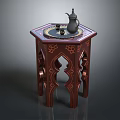 Traditional Wooden Coffee Table with Carved Patterns and Teapot on Top