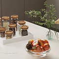 Glass Tableware Set with Jars with Wooden Lids Tray and Fruit Bowl on Marble Countertop