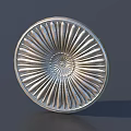 Intricate Metallic Circular Decorative Plate With Radiating Carved Patterns And Central Design