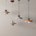 Modern Minimalist Pendant Lights With Various Designs And Different Colors Hanging Against White Background