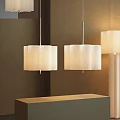Modern Two Pendant Lights With White Pleated Fabric Shades On Brown Wall Background