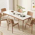 Minimalist Dining Table Set with White Top Wooden Legs Beige Cushion Chairs and Green Plant