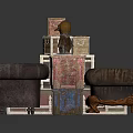 Dark Brown Tufted Sofa With Stacked Suitcases Wooden Boxes And Small Statue