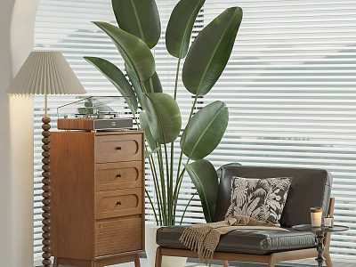 Comfortable Lounge Chair with Patterned Pillow Throw Blanket Wooden Chest Lamp and Large Green Plant 3d model