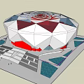 Large Circular Stadium With Geometric Exterior White Red Blue Panels And Plaza Green Space