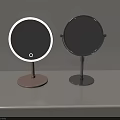 Two Round Lighted Vanity Mirrors With Pink And Silver Stand Bases 3d model