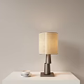 Modern Table Lamp With Beige Fabric Shade And Metallic Base On White Table 3d model