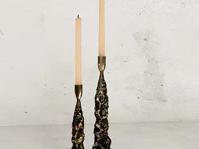 Decorative Gold And Black Candle Holders With White Candles On White Wall Background 3d model