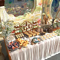 Assorted Desserts Fresh Fruit Platters And Bread Displays On Elegant Decorated Table With Flowers