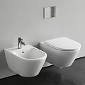 Modern White Wall Mounted Toilet In Bathroom With Bidet And Faucet