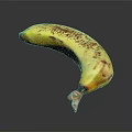 Yellow Banana With Brown Spots On Black Background Showing Reflective Surface