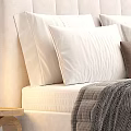 Modern Double Bed With Upholstered Headboard Multiple Pillows Brown Cushion And Striped Blanket