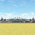 Ancient Architecture Featuring Intricate Dragon Sculptures Along Traditional Corridor Under Blue Sky