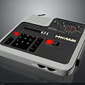 Portable Electronic Living Device With White Case Black Panel Red Buttons Knobs And