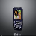 Old Blue Mobile Phone With Keypad And Screen Displaying Person