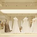 Bridal Wedding Dress Shop With Various Hanging Gowns And Elegant Interior Design