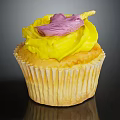 Appetizing Cupcake With Yellow Frosting And Purple Decoration On Ruffled Paper Liner