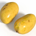 Two Fresh Juicy Ripe Bright Yellow Mangoes Isolated on White Background